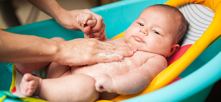 giving a newborn a bath